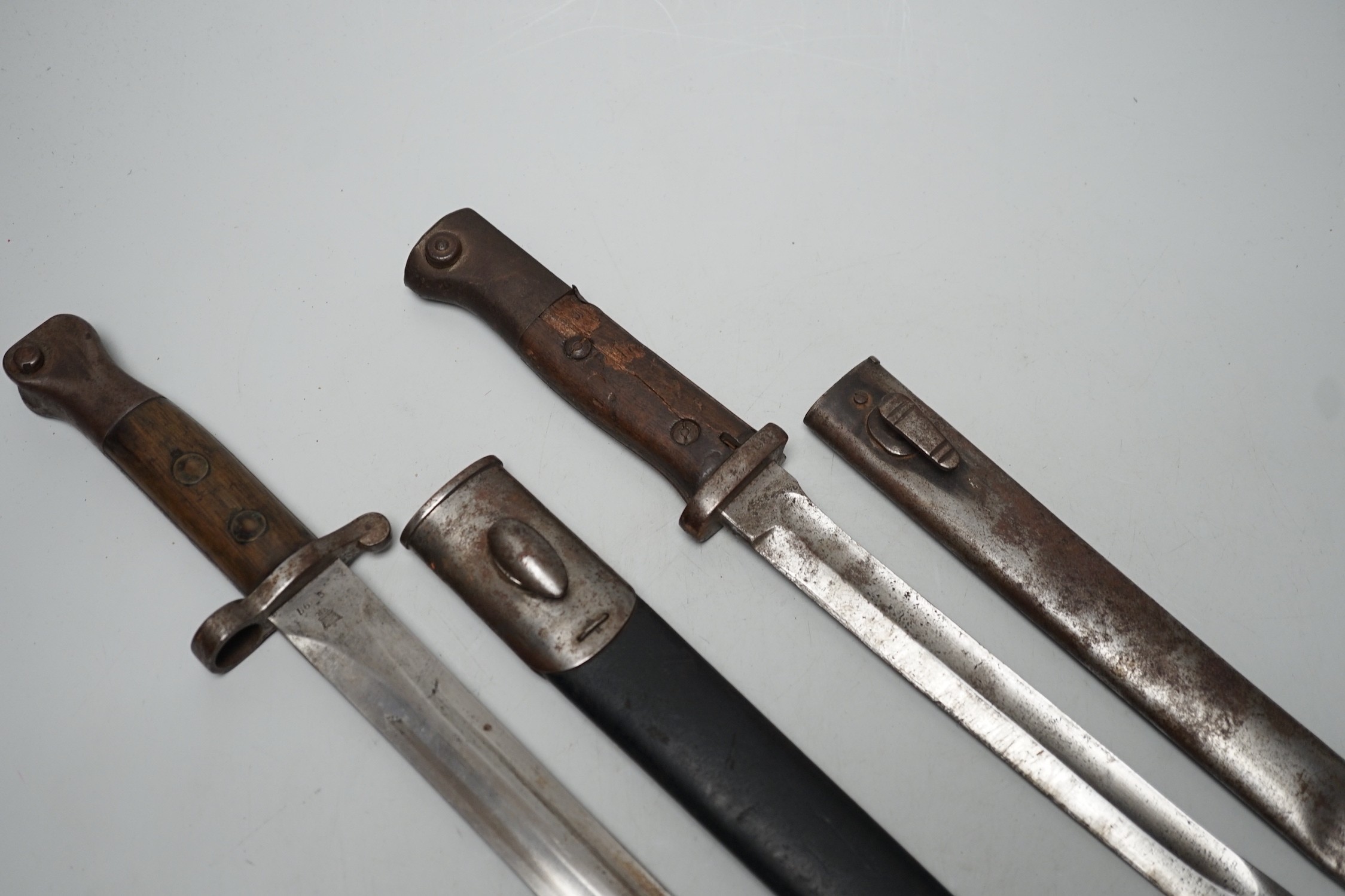 A 19th century British bayonet and scabbard together with a German bayonet and scabbard, the blade stamped Gottlieb Hammesfahr Solingen Foche